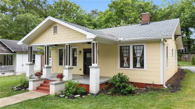 315 W Ave, Cartersville, GA 30120 - view of front of home featuring ceiling fan, a porch, a chimney, and a front lawn