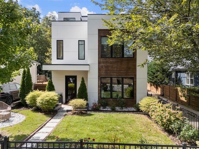 contemporary house featuring a front lawn