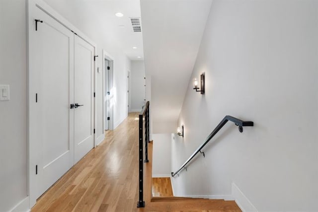 stairs featuring wood-type flooring