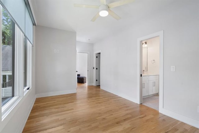 unfurnished room with ceiling fan and light hardwood / wood-style flooring