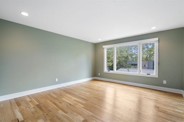 empty room with light hardwood / wood-style floors