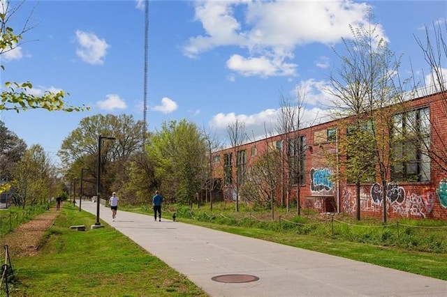 view of home's community featuring a lawn