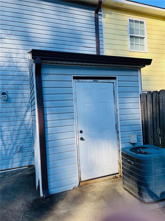 property entrance featuring central AC