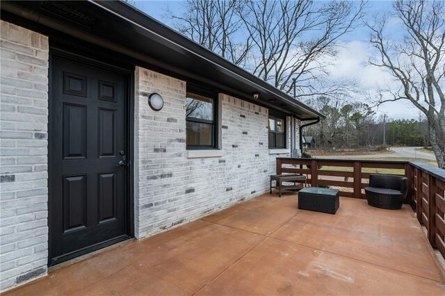 rear view of house with central AC, an outdoor fire pit, and a deck