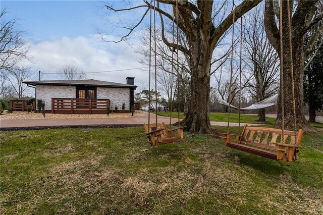 rear view of property with a yard