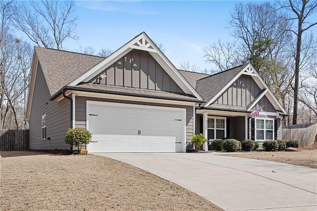 craftsman inspired home with board and batten siding, a garage, and fence