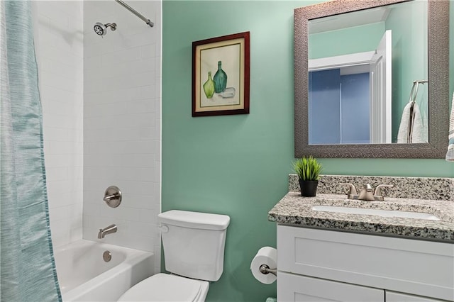 full bath featuring shower / bathtub combination with curtain, toilet, and vanity