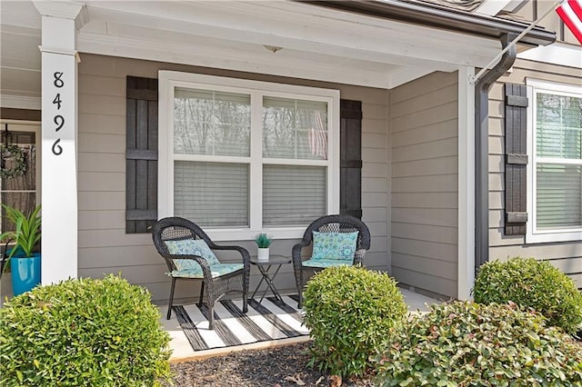 view of exterior entry featuring a porch