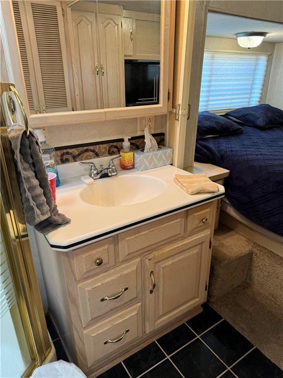 bathroom featuring vanity and tile patterned floors