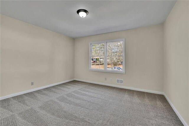 empty room featuring carpet floors