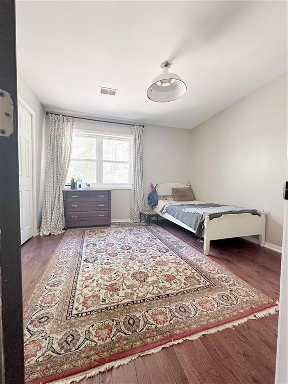 bedroom with hardwood / wood-style flooring