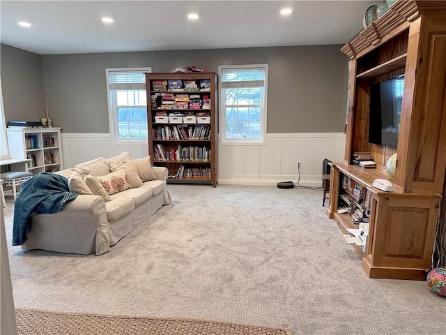 living room with light carpet and a wealth of natural light