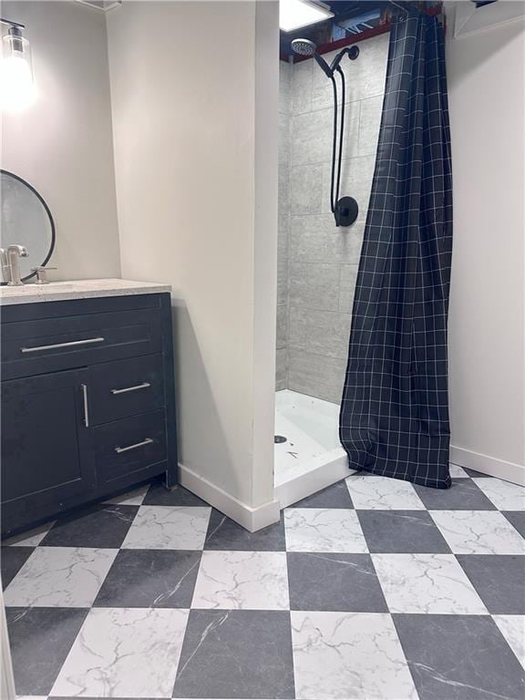 bathroom with vanity and tiled shower