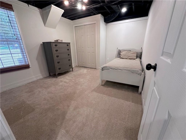 carpeted bedroom featuring a closet