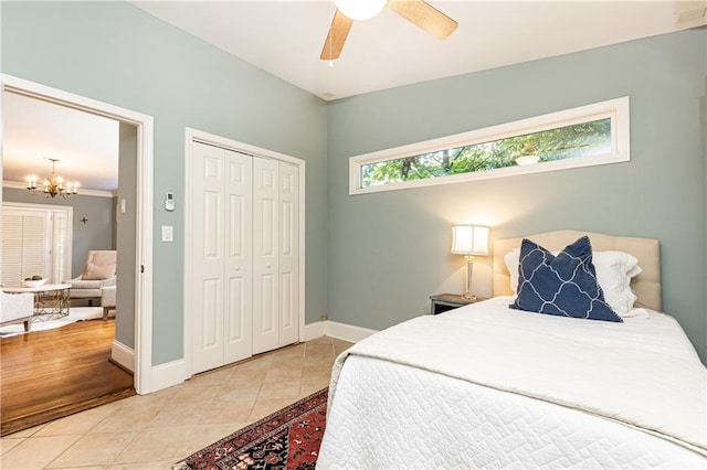 2197 Fairway Cir NE, Brookhaven, GA 30319 - bedroom featuring a chandelier, tile patterned floors, a closet, and baseboards