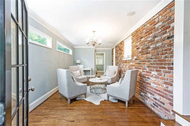 2197 Fairway Cir NE, Brookhaven, GA 30319 - sitting room featuring brick wall, a chandelier, wood finished floors, baseboards, and ornamental molding