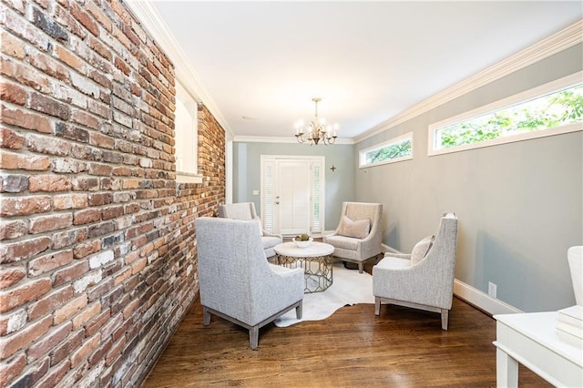 2197 Fairway Cir NE, Brookhaven, GA 30319 - sitting room featuring brick wall, a chandelier, wood finished floors, ornamental molding, and baseboards