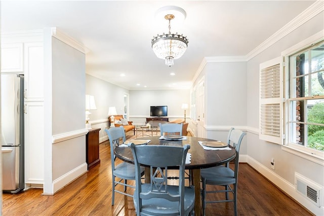 2197 Fairway Cir NE, Brookhaven, GA 30319 - dining area with wood finished floors, baseboards, a chandelier, ornamental molding, and recessed lighting
