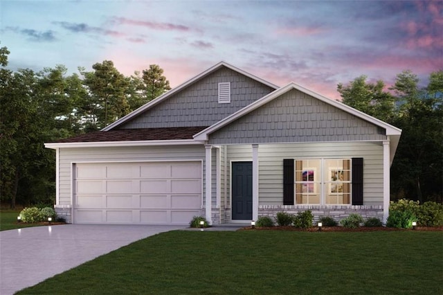 view of front facade with driveway, a lawn, and an attached garage