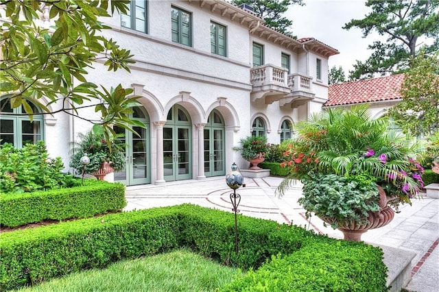 doorway to property featuring a balcony