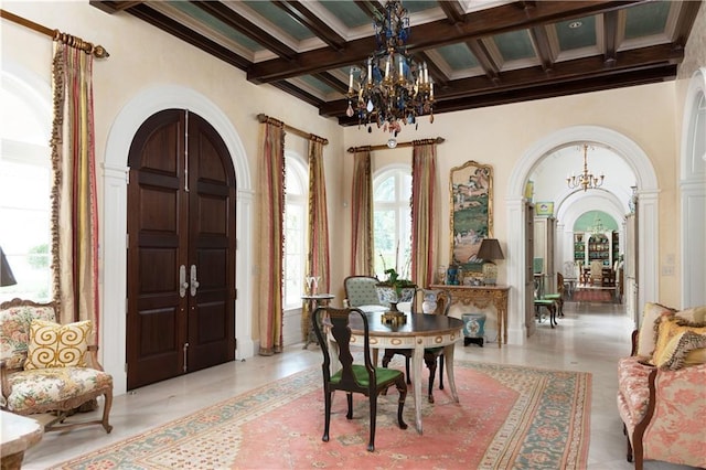 interior space with beamed ceiling, a chandelier, and coffered ceiling