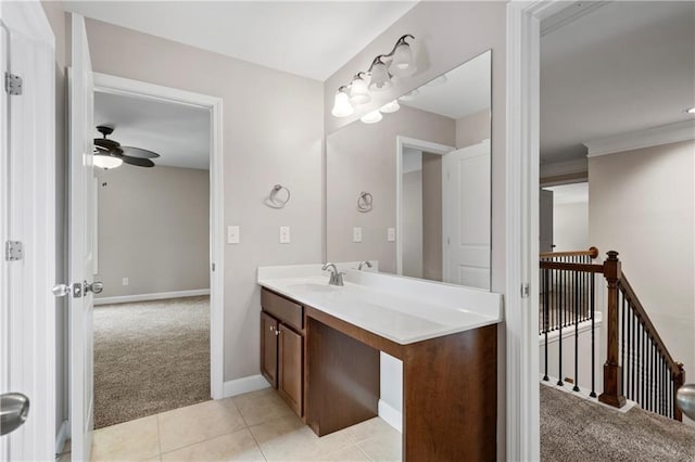 bathroom with tile patterned flooring, vanity, and ceiling fan