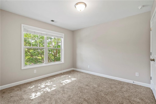 unfurnished room featuring carpet flooring