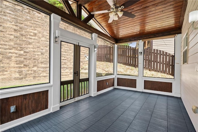 unfurnished sunroom with lofted ceiling, wood ceiling, and ceiling fan