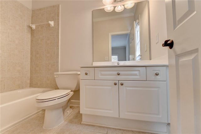 bathroom featuring crown molding, bathtub / shower combination, toilet, vanity, and tile patterned flooring