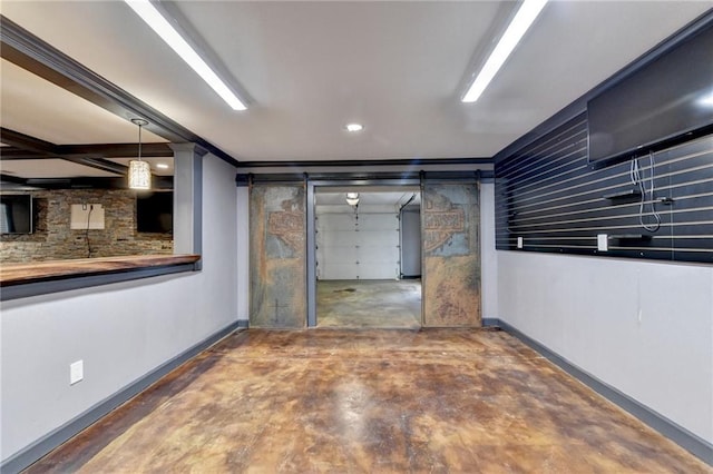 interior space with a garage and baseboards