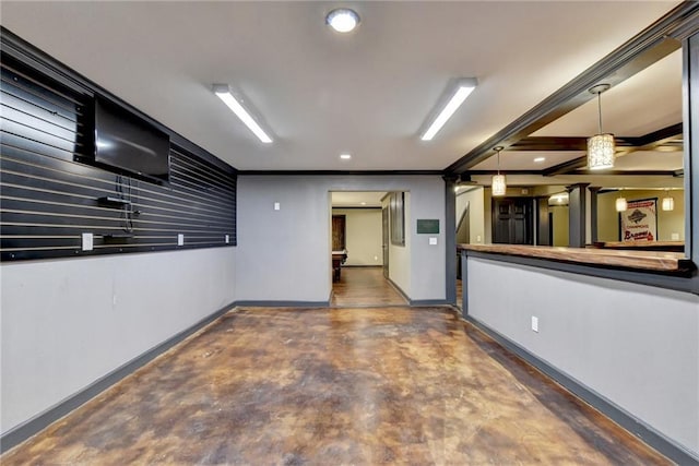 spare room with concrete flooring, recessed lighting, and baseboards