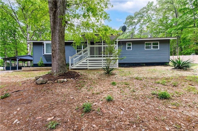 view of front facade with fence and a deck