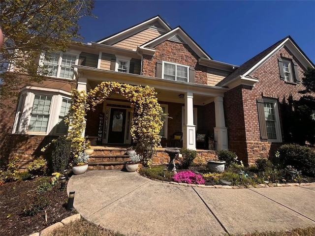 7113 Artisans Way, Flowery Branch, GA 30542 - craftsman-style house featuring stone siding and a porch