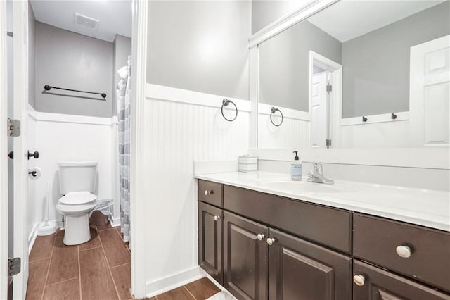 bathroom with toilet and vanity