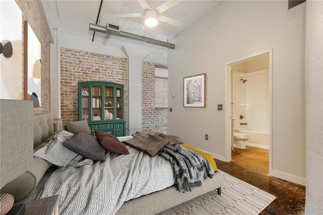 bedroom with ceiling fan, ensuite bath, lofted ceiling, and multiple windows