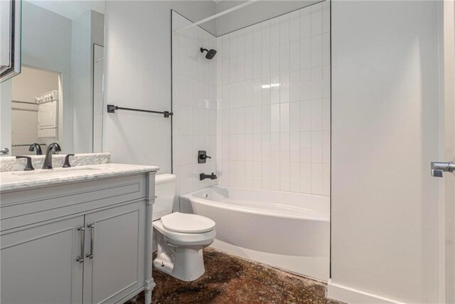 full bathroom featuring vanity, toilet, and tiled shower / bath