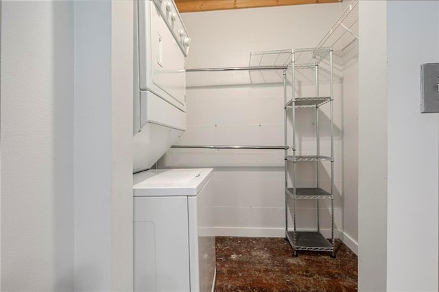 laundry room featuring stacked washer / dryer