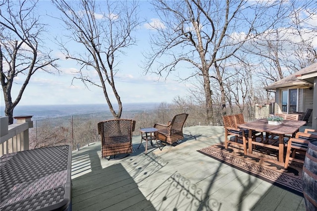 wooden deck featuring outdoor dining space