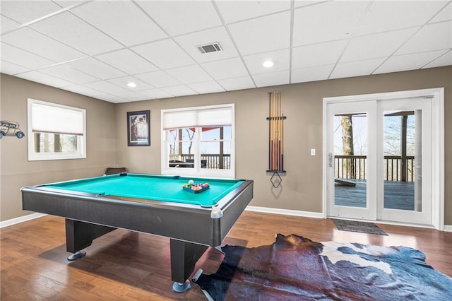 rec room with a paneled ceiling, wood-type flooring, and billiards