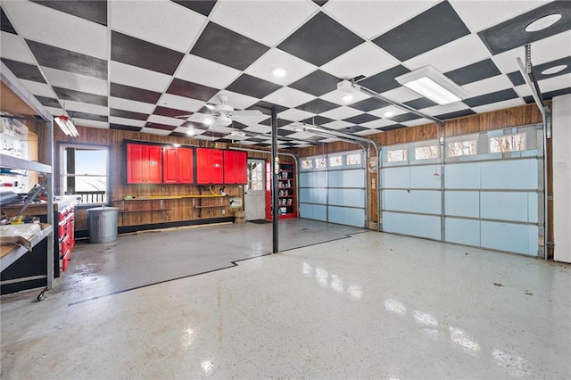 garage featuring wood walls