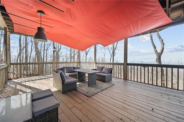 wooden deck with an outdoor living space