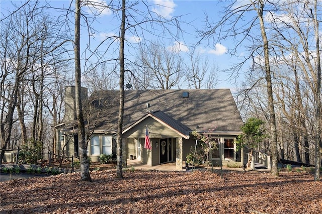 view of front of home with a chimney