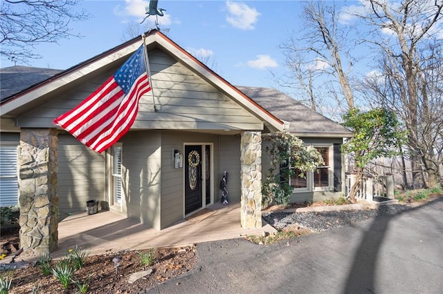 view of front of house featuring a shingled roof