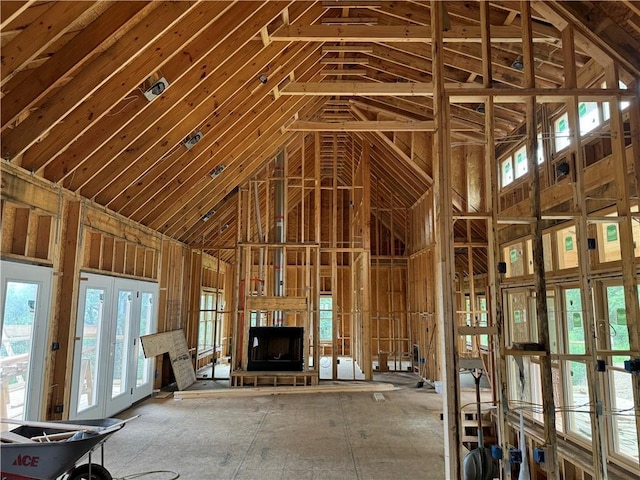 miscellaneous room with high vaulted ceiling