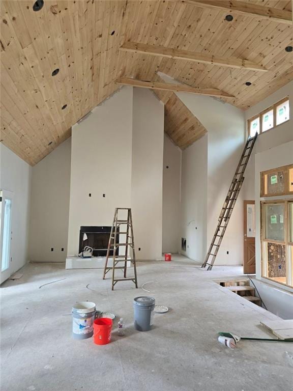 interior space with wood ceiling and high vaulted ceiling