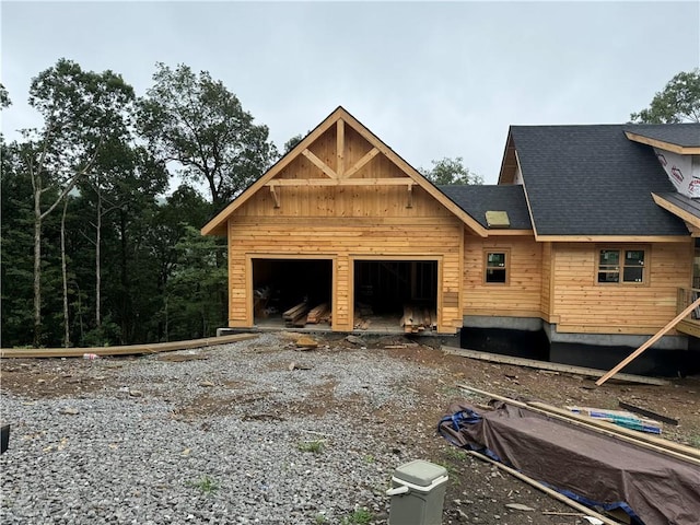 view of side of home with a garage