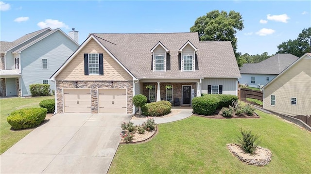 401 Oscar Way, Dallas, GA 30132 - view of front facade featuring concrete driveway, an attached garage, stone siding, and roof with shingles