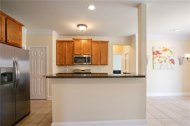 401 Oscar Way, Dallas, GA 30132 - kitchen featuring stainless steel appliances, light tile patterned floors, brown cabinets, and ornamental molding