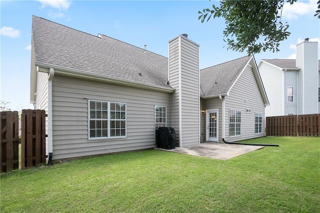 401 Oscar Way, Dallas, GA 30132 - rear view of house with a fenced backyard, a chimney, a patio area, and roof with shingles