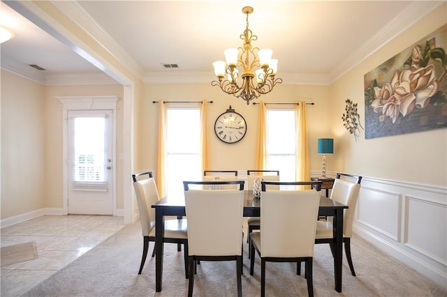401 Oscar Way, Dallas, GA 30132 - dining room with a chandelier, healthy amount of natural light, crown molding, and light colored carpet